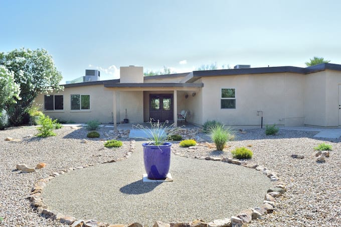 Exterior view of the assisted living facility with landscaping