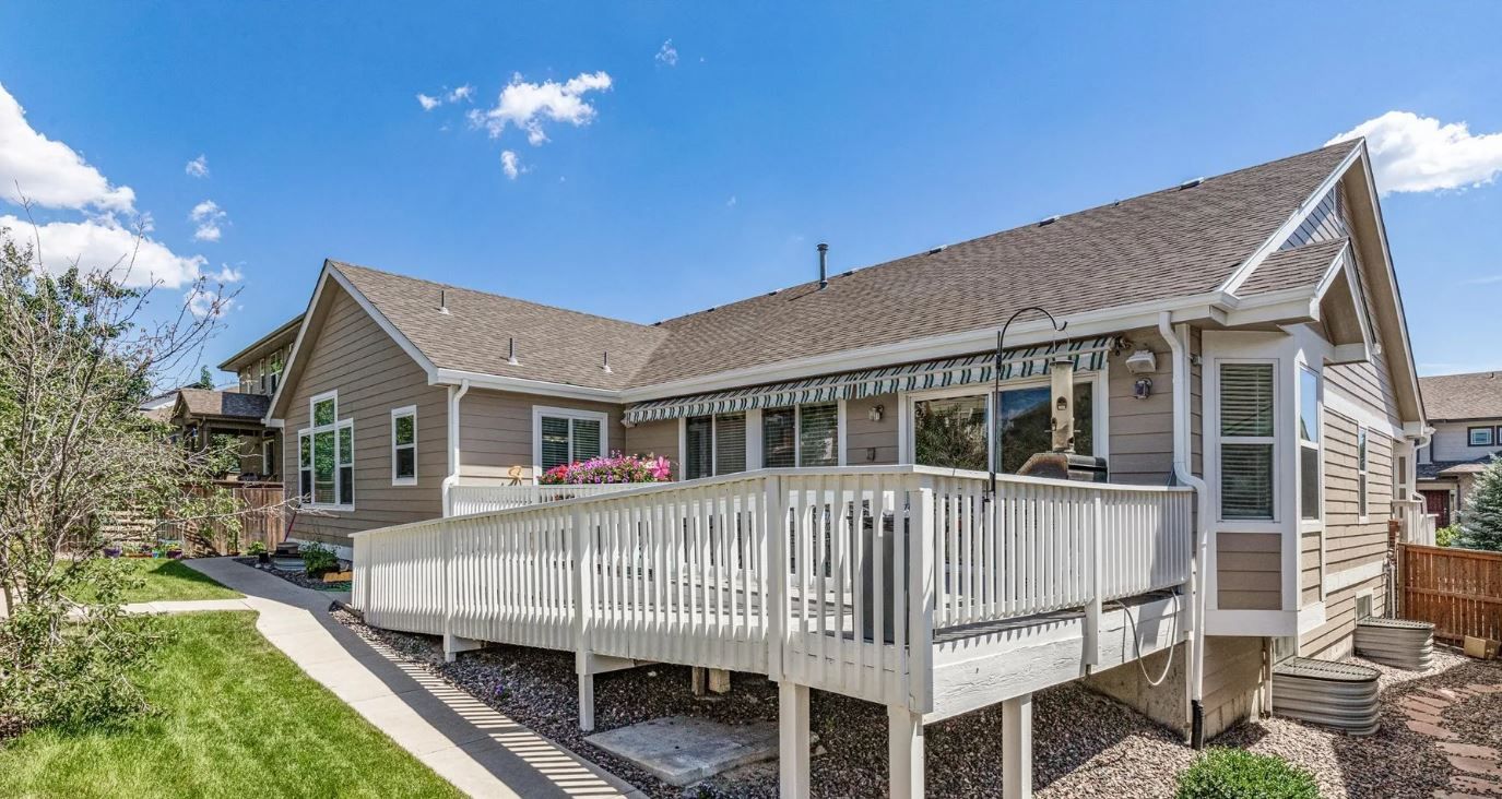 Exterior view of a senior living facility with outdoor space