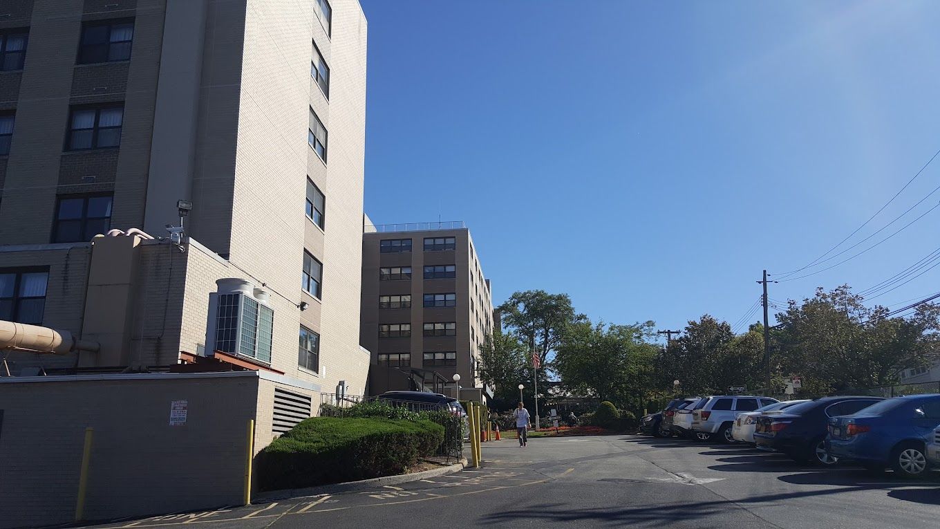 Exterior view of the facility with parking area