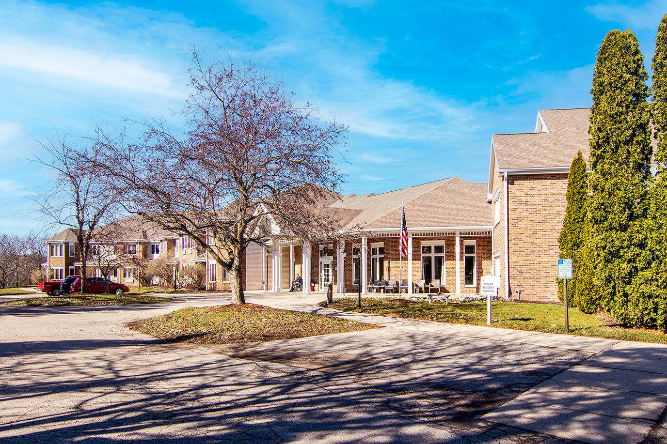 Exterior view of a senior living facility with landscaped grounds