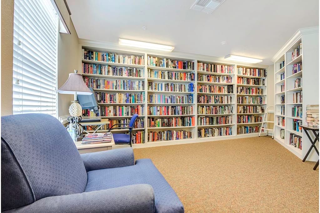 Cozy reading nook with bookshelves filled with books