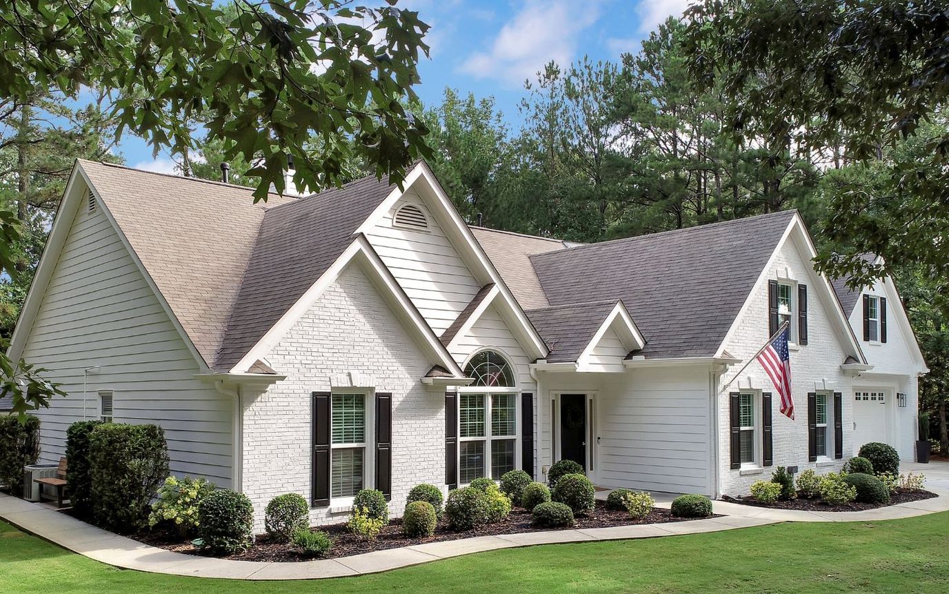 Exterior view of a senior living facility with well-maintained landscaping