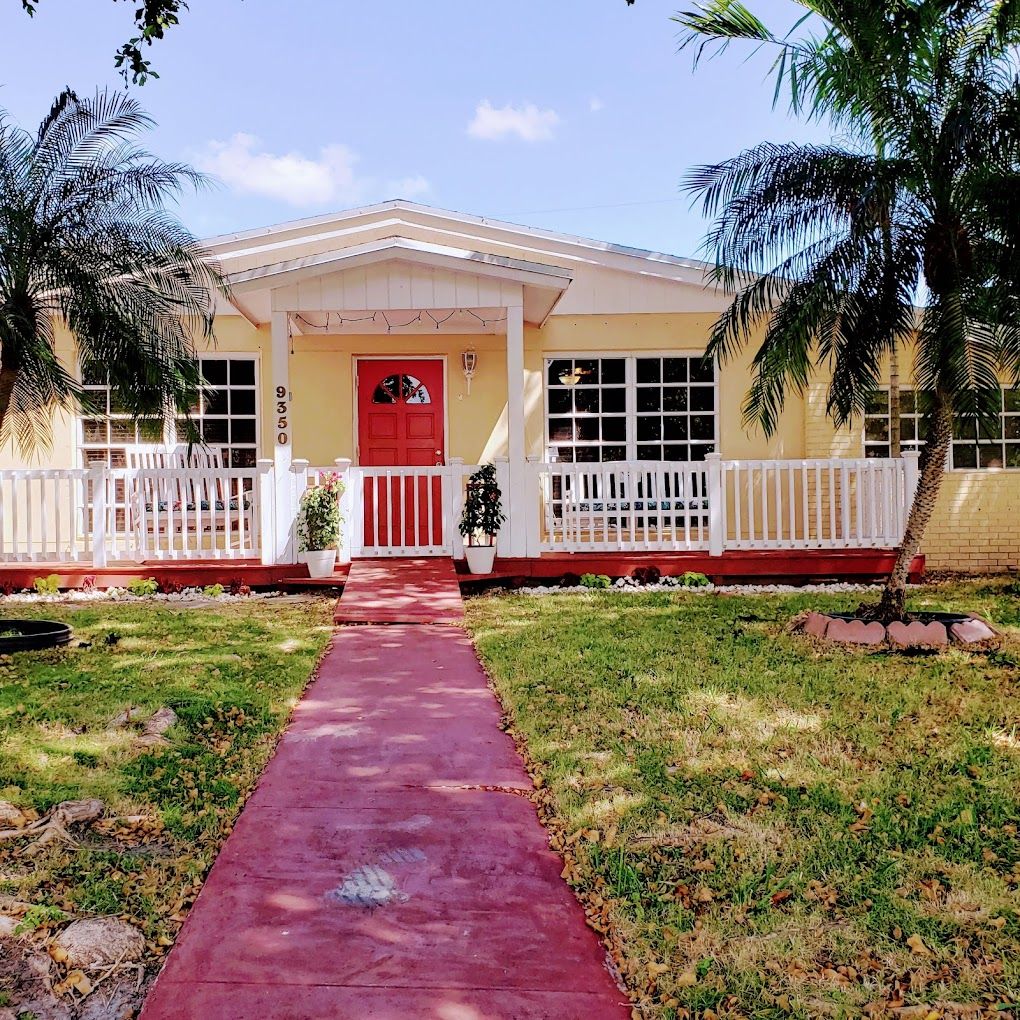 Exterior view of a senior living facility with a pathway