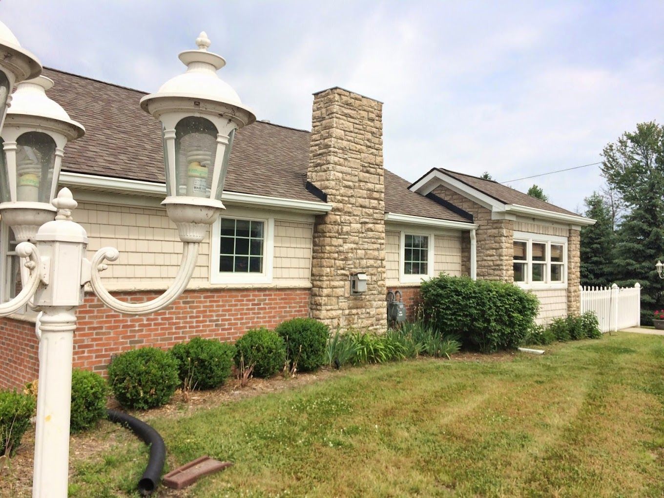 Exterior view of a brick building with a garden