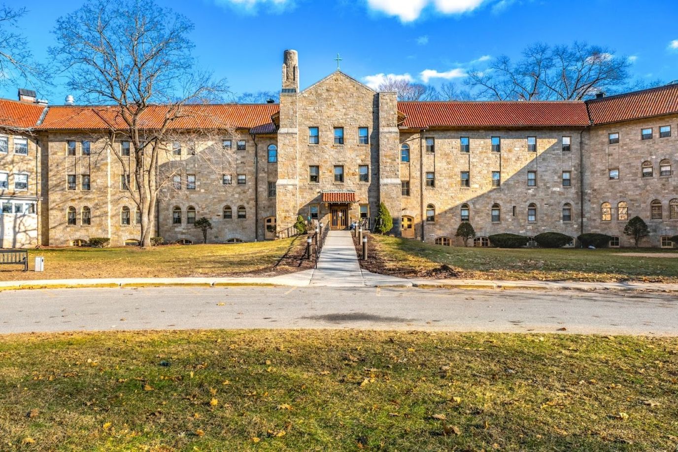 Exterior view of a senior living facility with landscaped grounds
