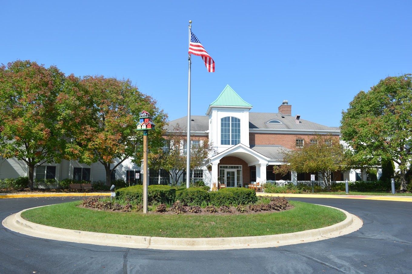 Exterior view of River Glen of St. Charles with flag