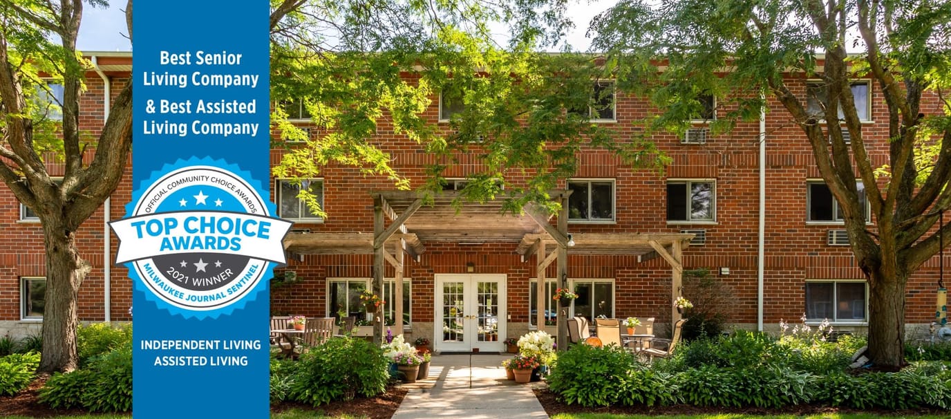 Exterior view of Summit Woods with award banner