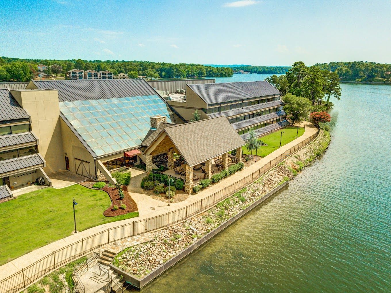 Aerial view of the facility by the water with gardens