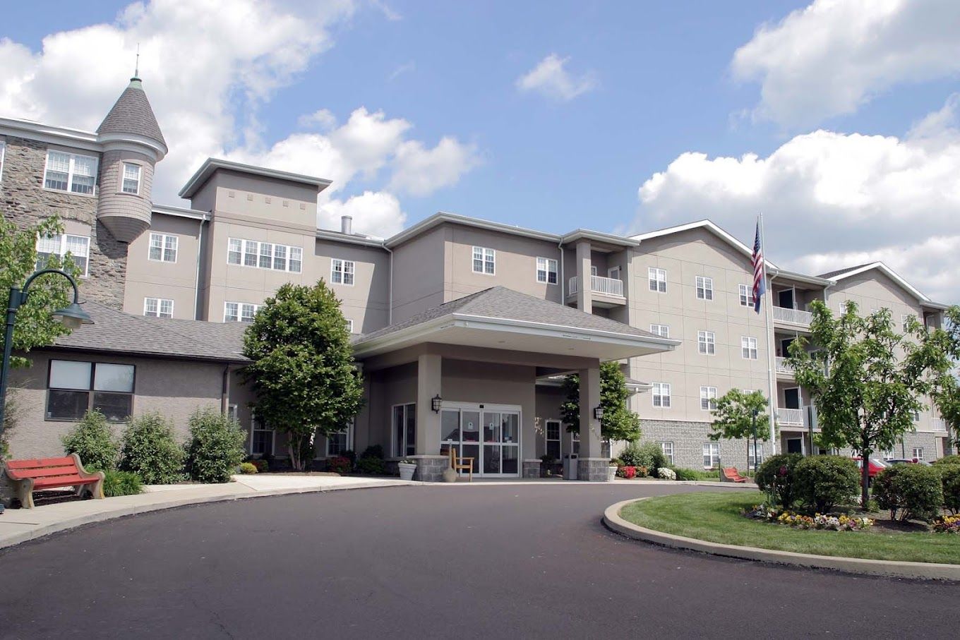 Exterior view of the assisted living facility showing landscaping and entrance