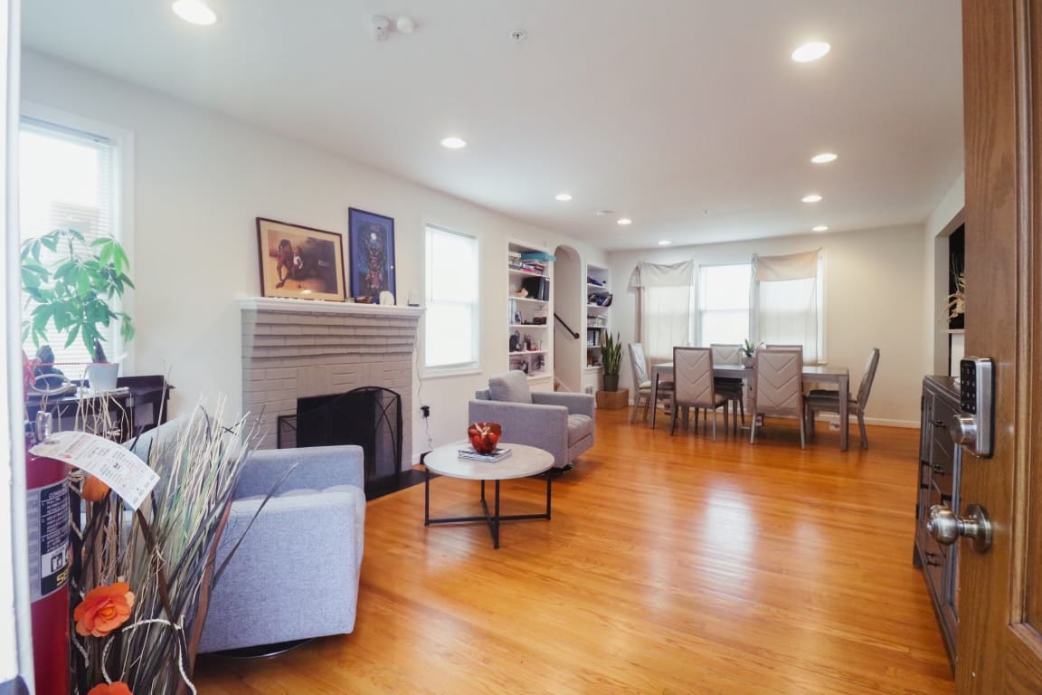 Bright common area with seating and dining space