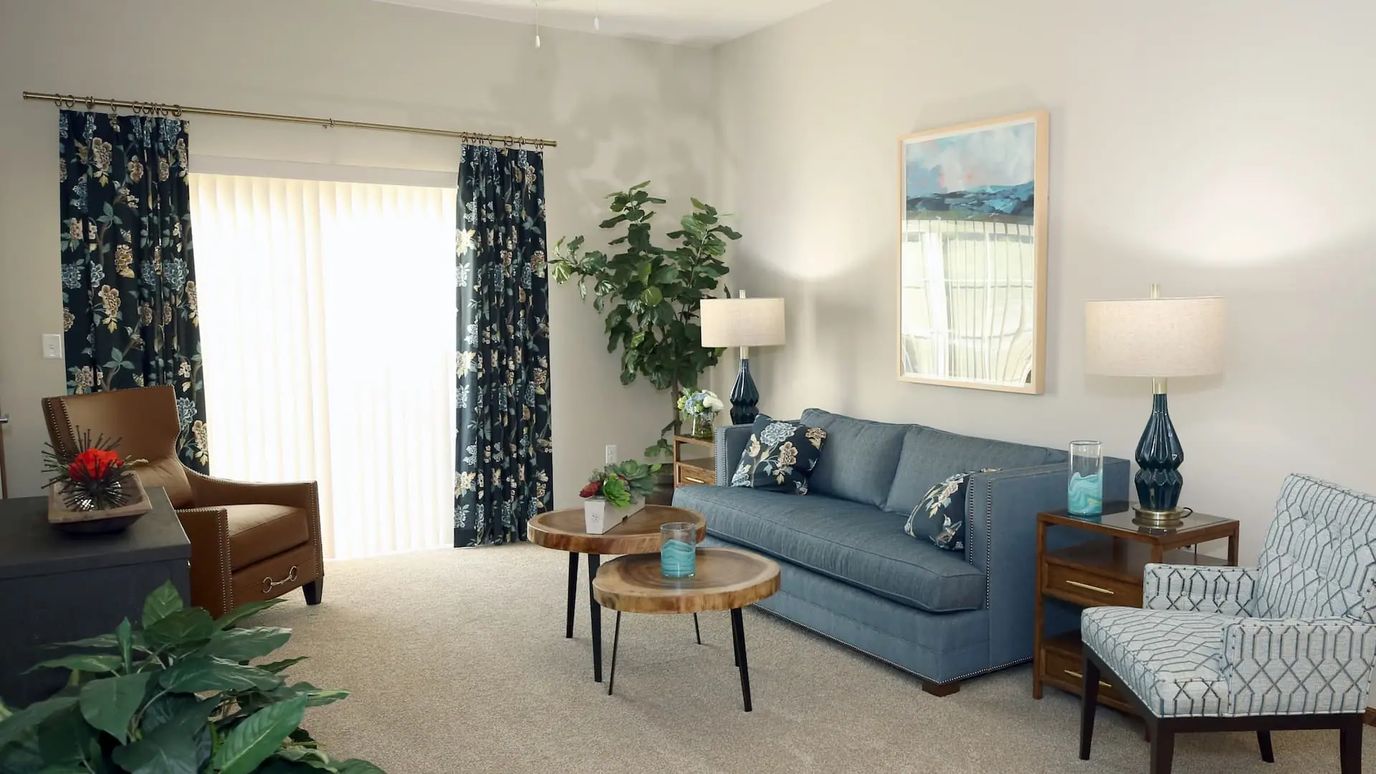 Cozy common area with a couch and plants