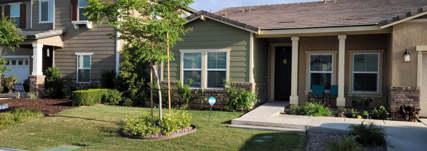 Exterior view of a residential care facility with landscaping