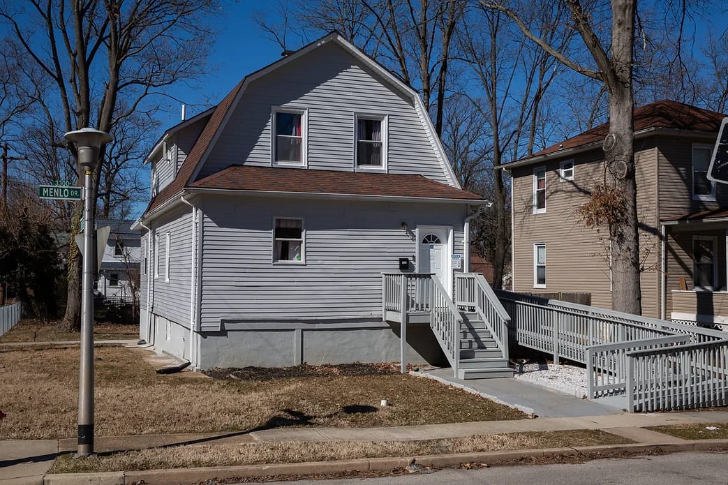 Exterior view of a residential facility with ramp