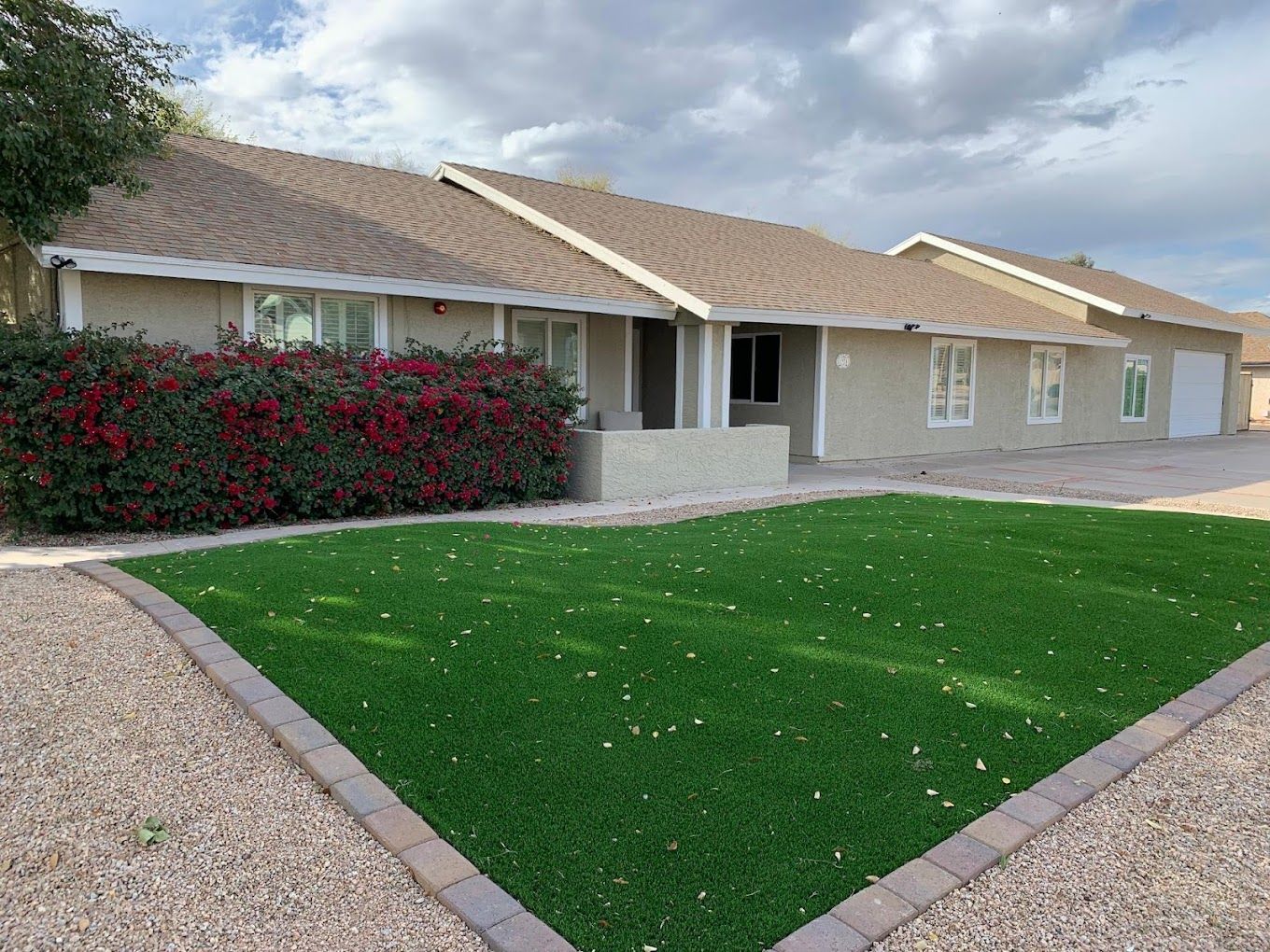 Exterior view of a single-story building with landscaping