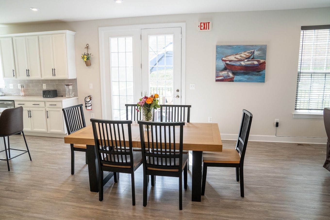 Bright dining area with a wooden table and chairs