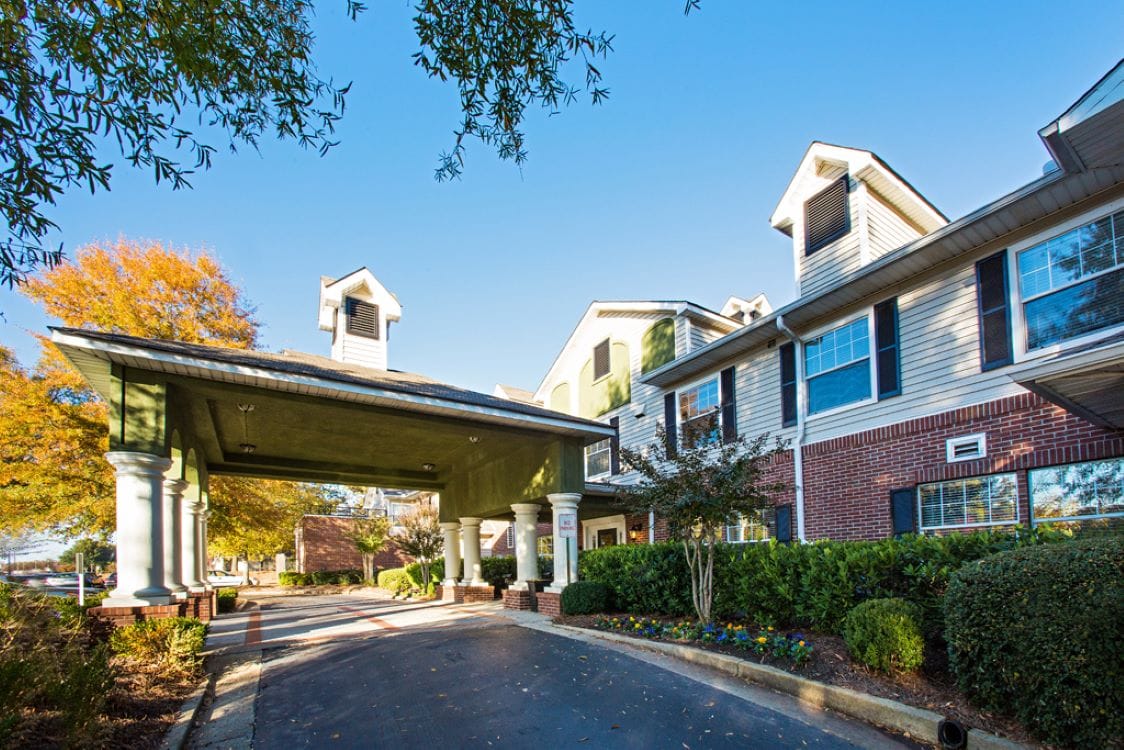 The exterior of Regal Pointe East Cobb with landscaped entrance