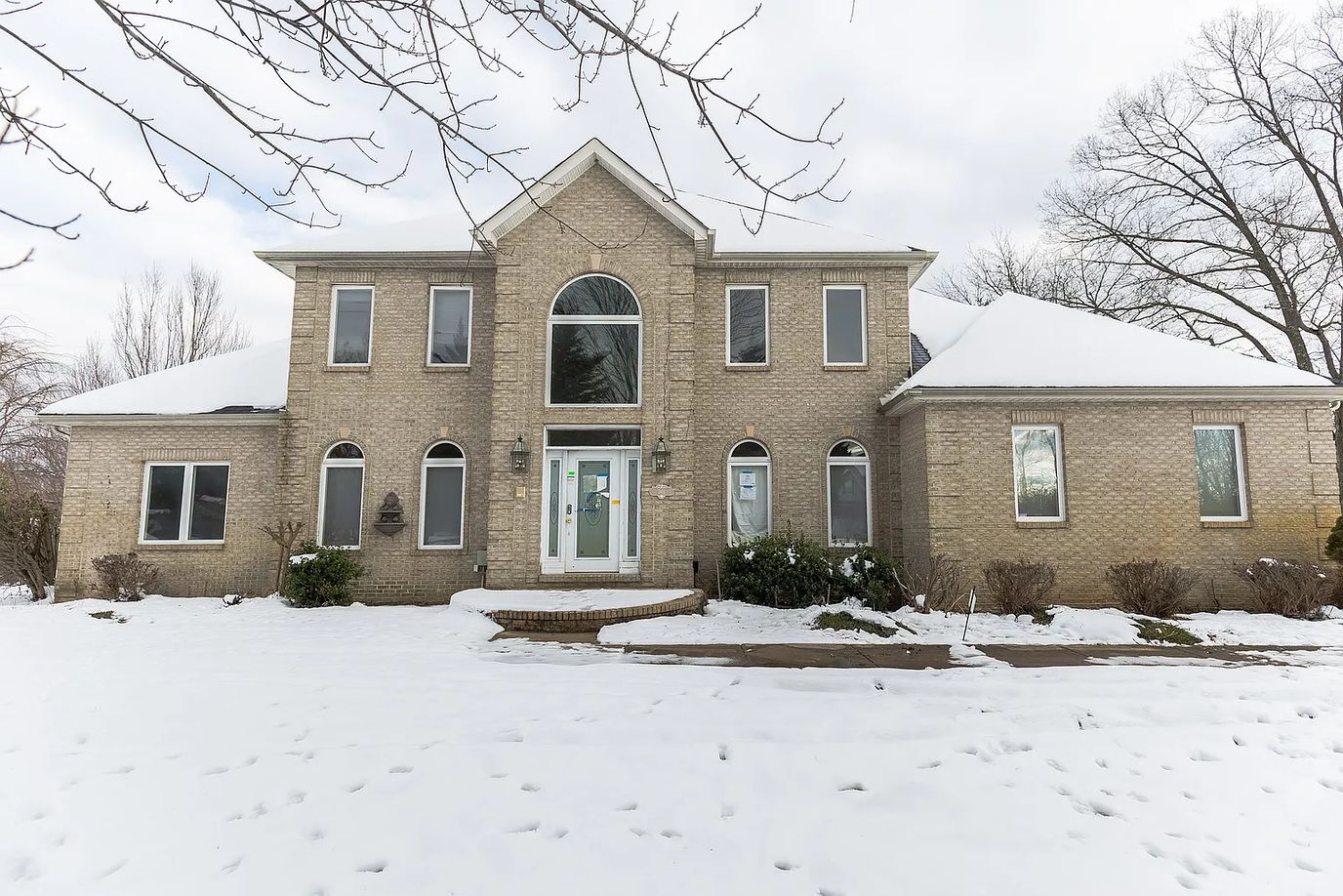 Exterior view of a large house in winter