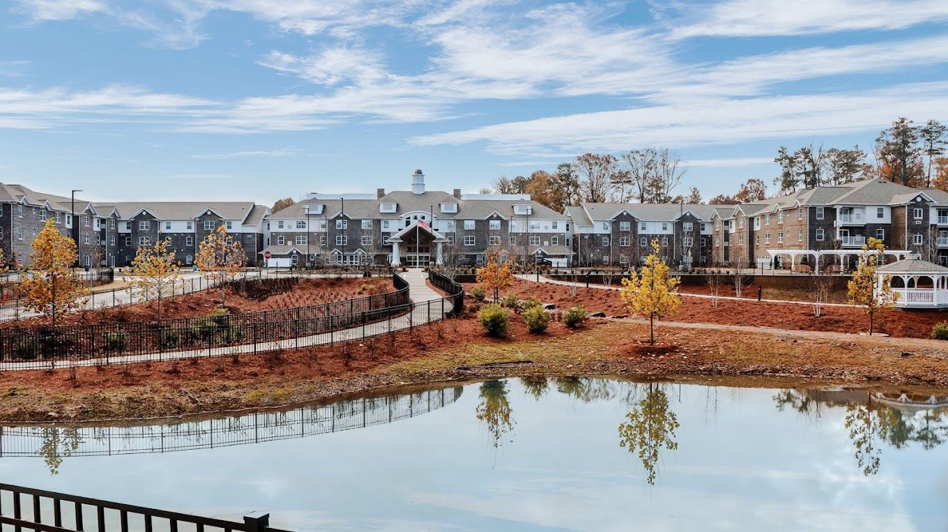 Building exterior with landscaped outdoor space and water feature