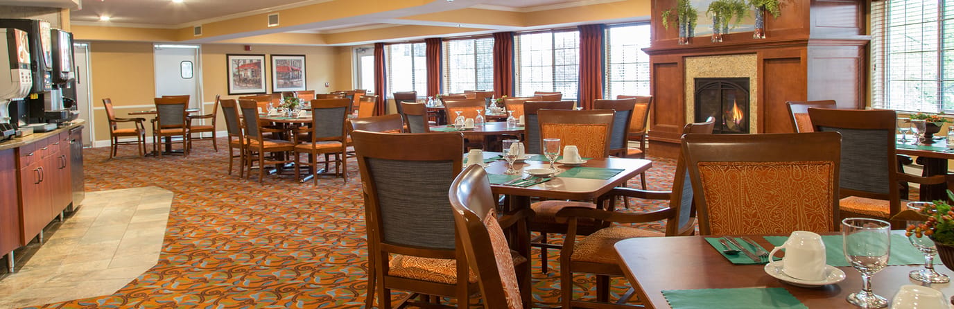 Well-decorated dining room with tables set for dining