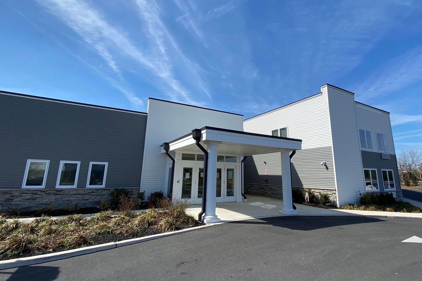 Exterior view of the entrance to New Standard Senior Living