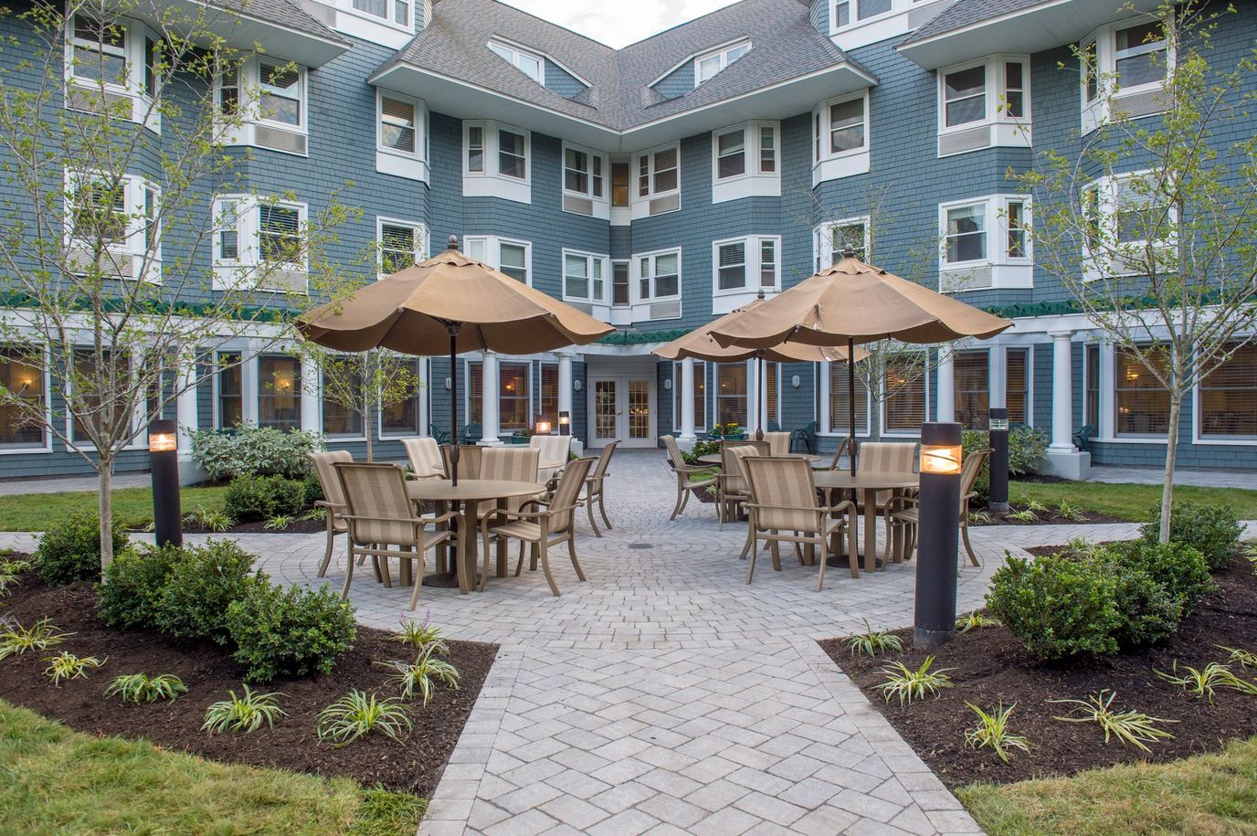 Outdoor seating area with tables and umbrellas