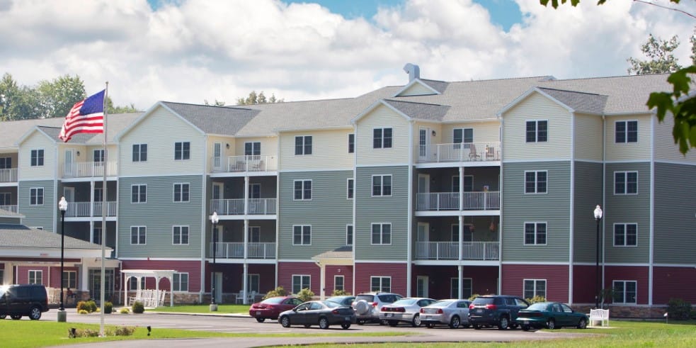 Exterior view of Armbrook Village with landscaped grounds