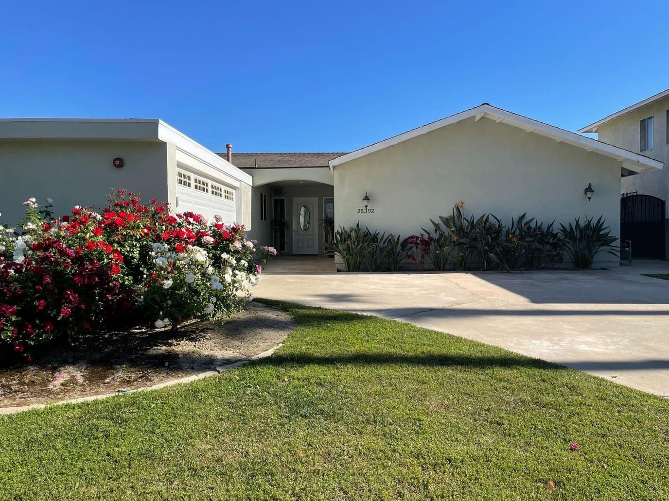 Exterior view of a senior care facility with garden