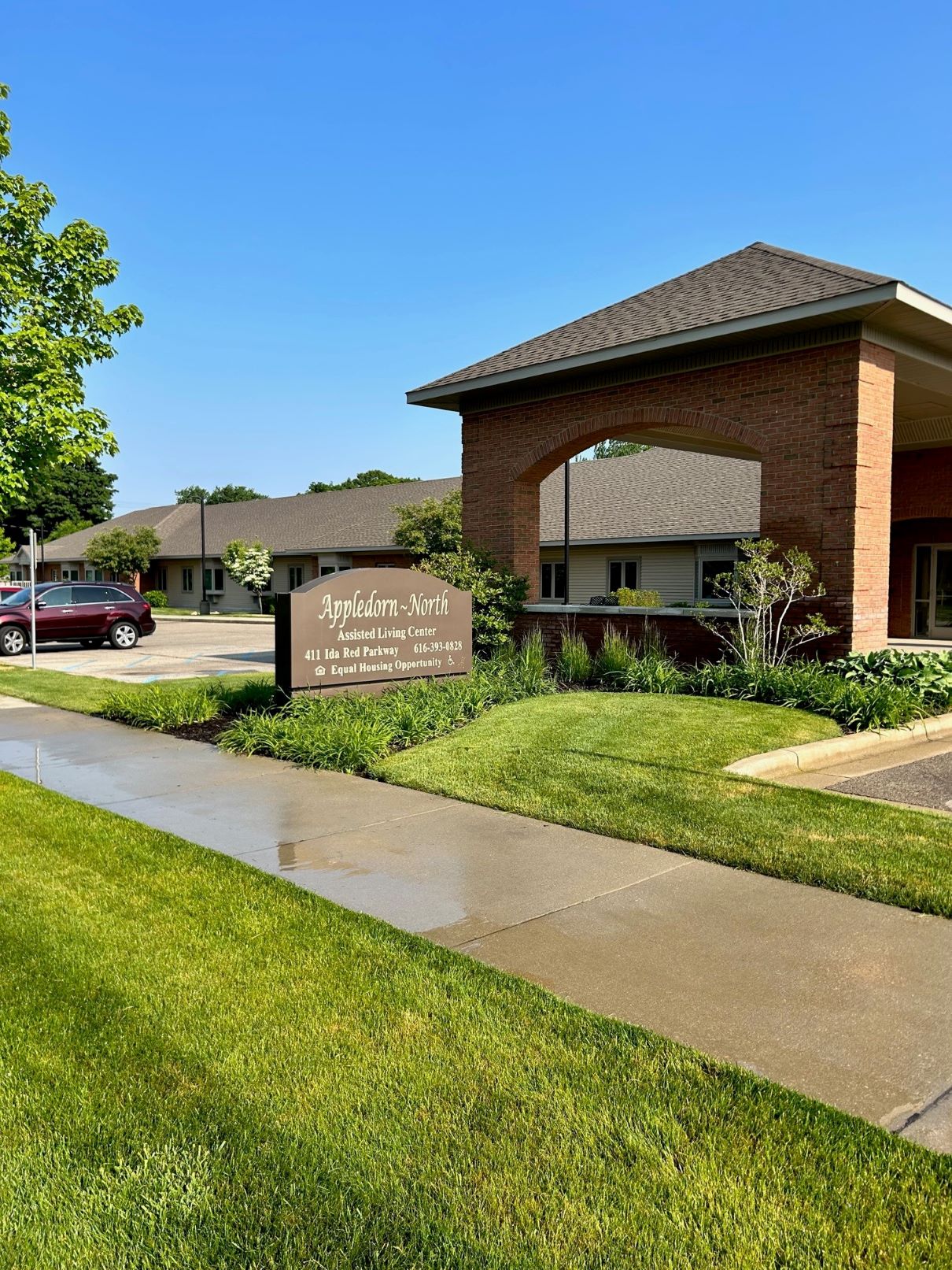 Exterior view of Appledorn Assisted Living Center North with signage