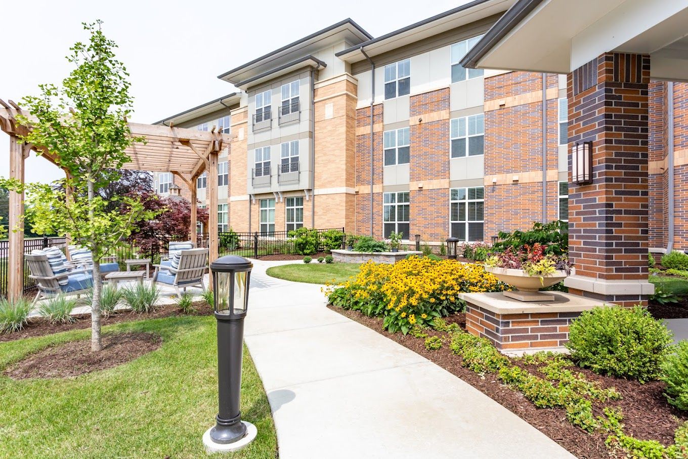 Garden area with walking path and exterior of building