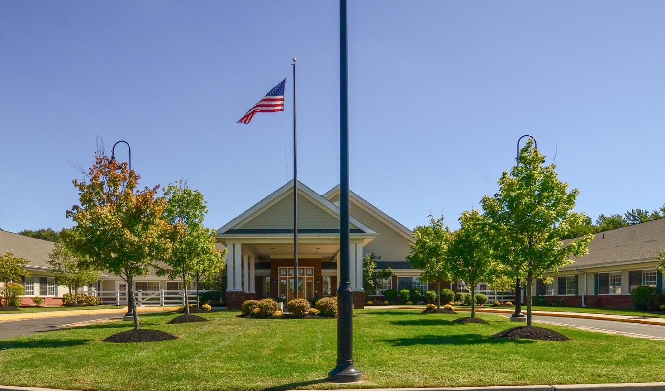 Exterior view of a senior living facility with landscaping