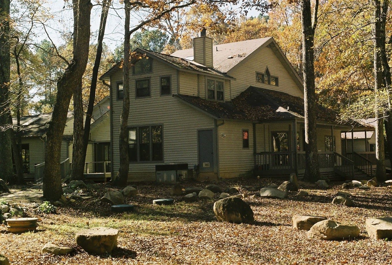 Exterior view of a care home surrounded by trees