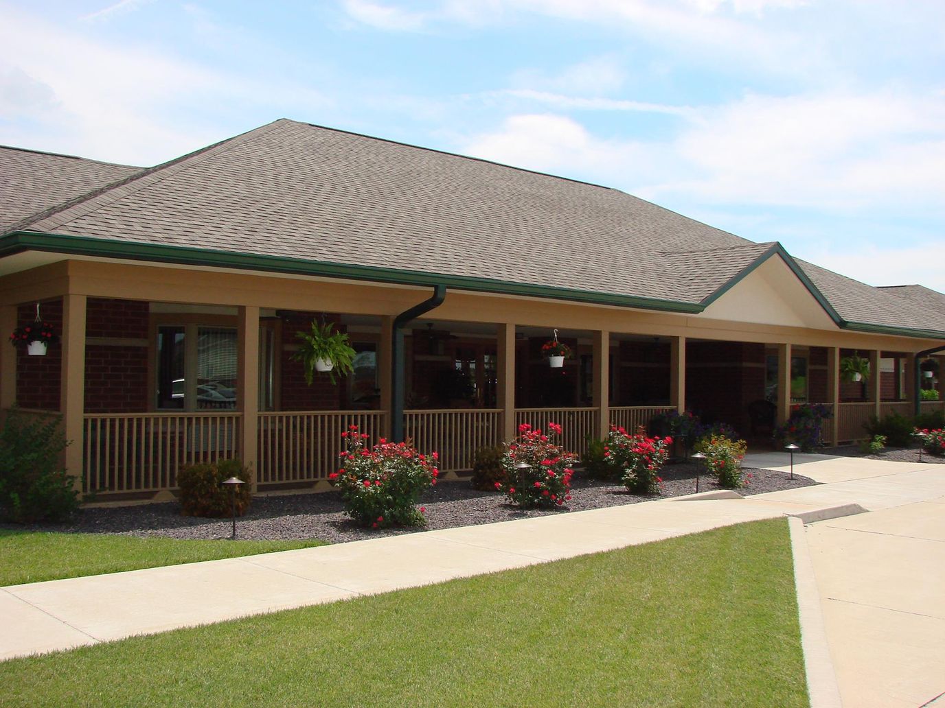 Exterior view of the assisted living facility with garden