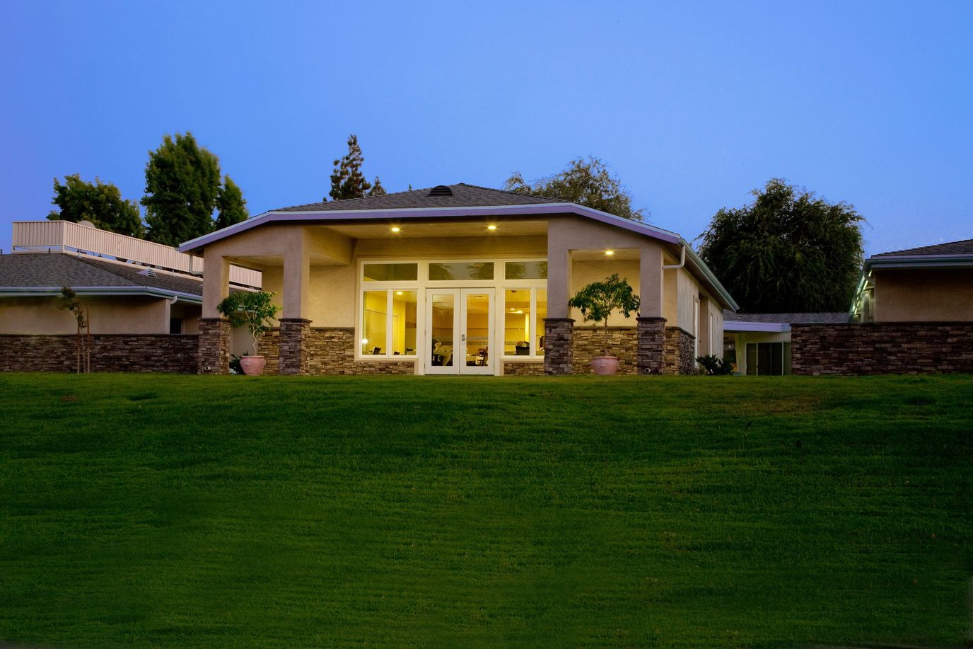 Exterior view of Heritage Gardens at dusk