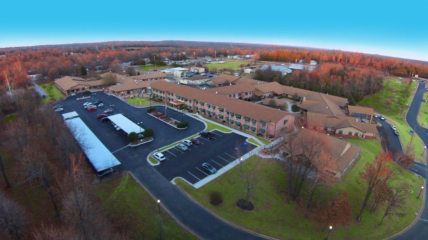 Aerial view of Lake Forest Senior Living facility surrounded by trees