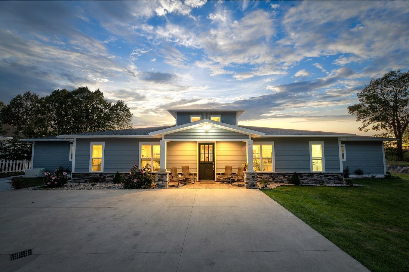 Exterior view of a senior living facility at dusk