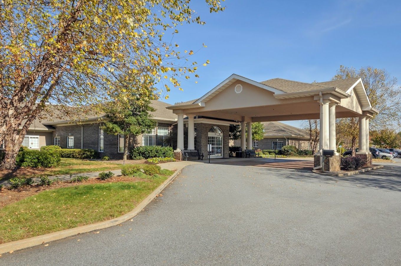 Building exterior view with entrance and landscaping