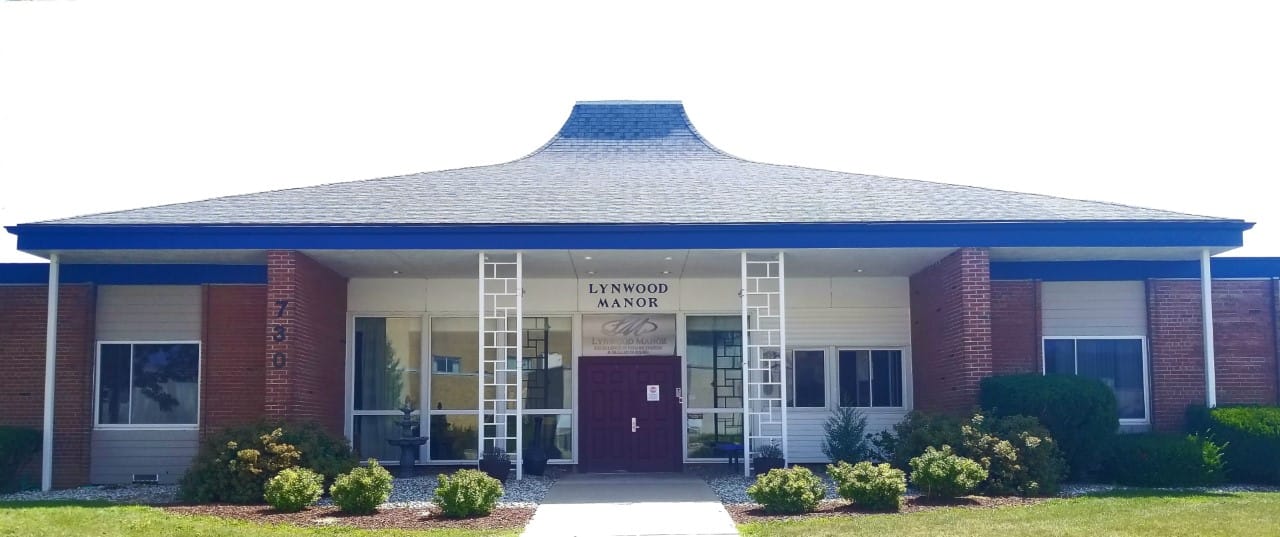 Exterior view of Lynwood Manor with landscaping