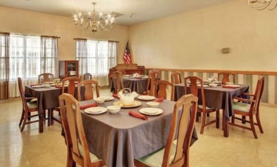 Dining room setup with tables and chairs