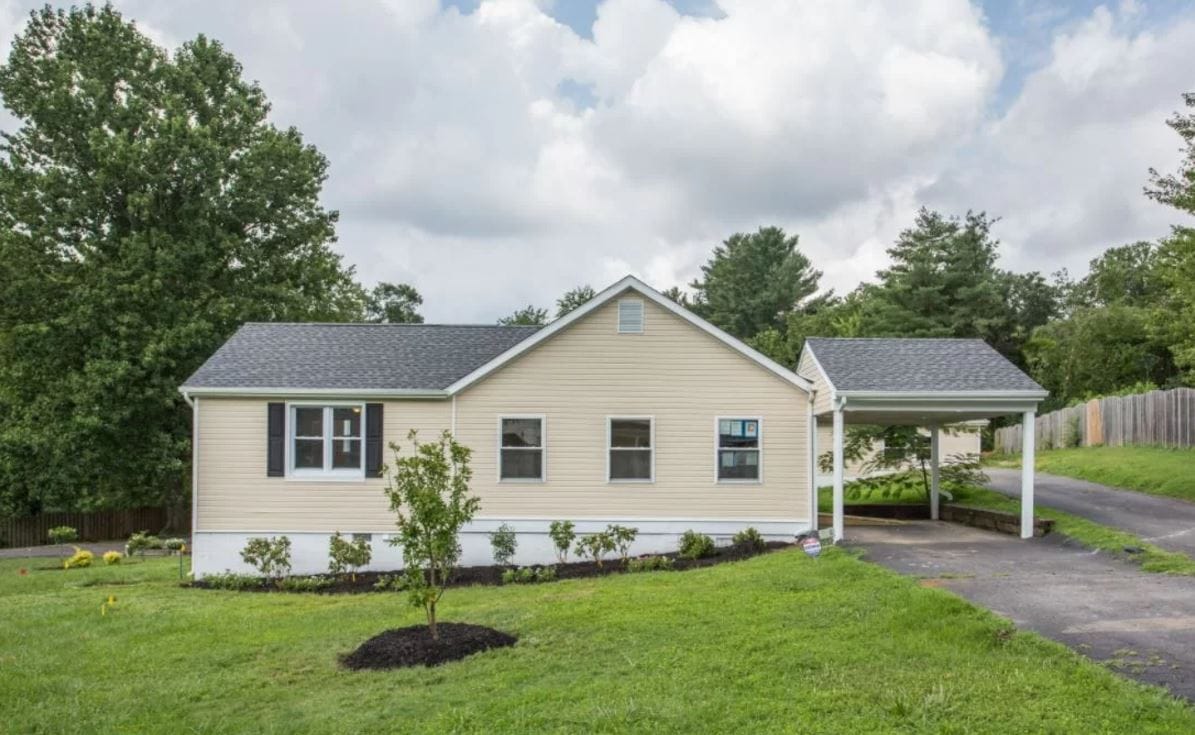 Exterior view of a senior living facility with garden