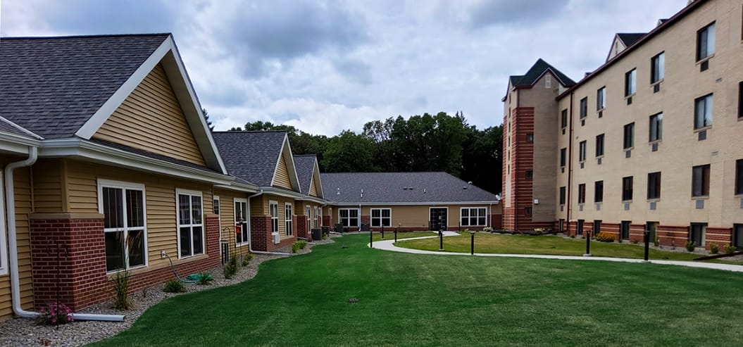 Exterior view of Parker Oaks Senior Living with landscaped grounds