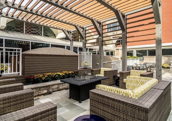 Outdoor seating area with flowers and shade