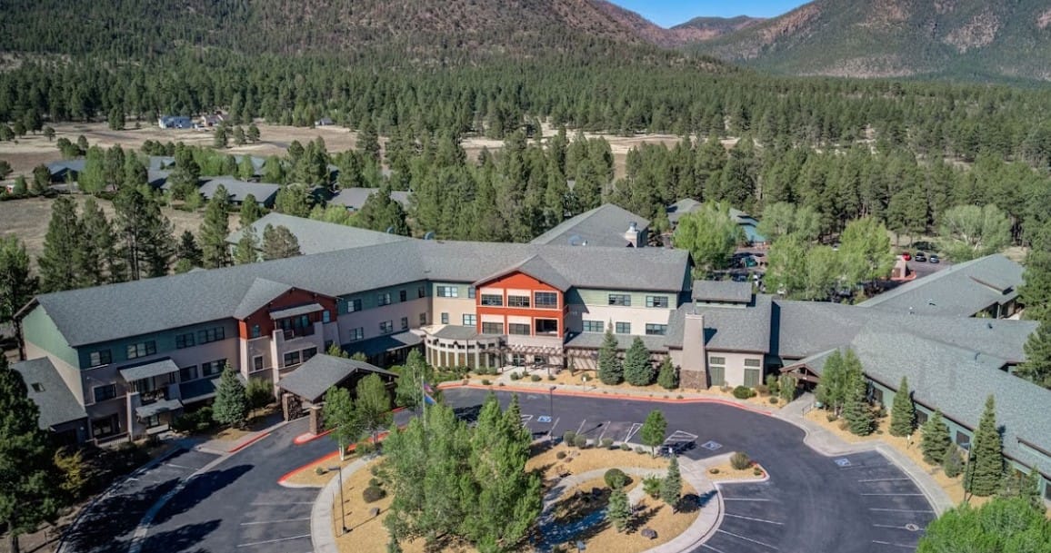 Aerial view of a senior living facility surrounded by nature
