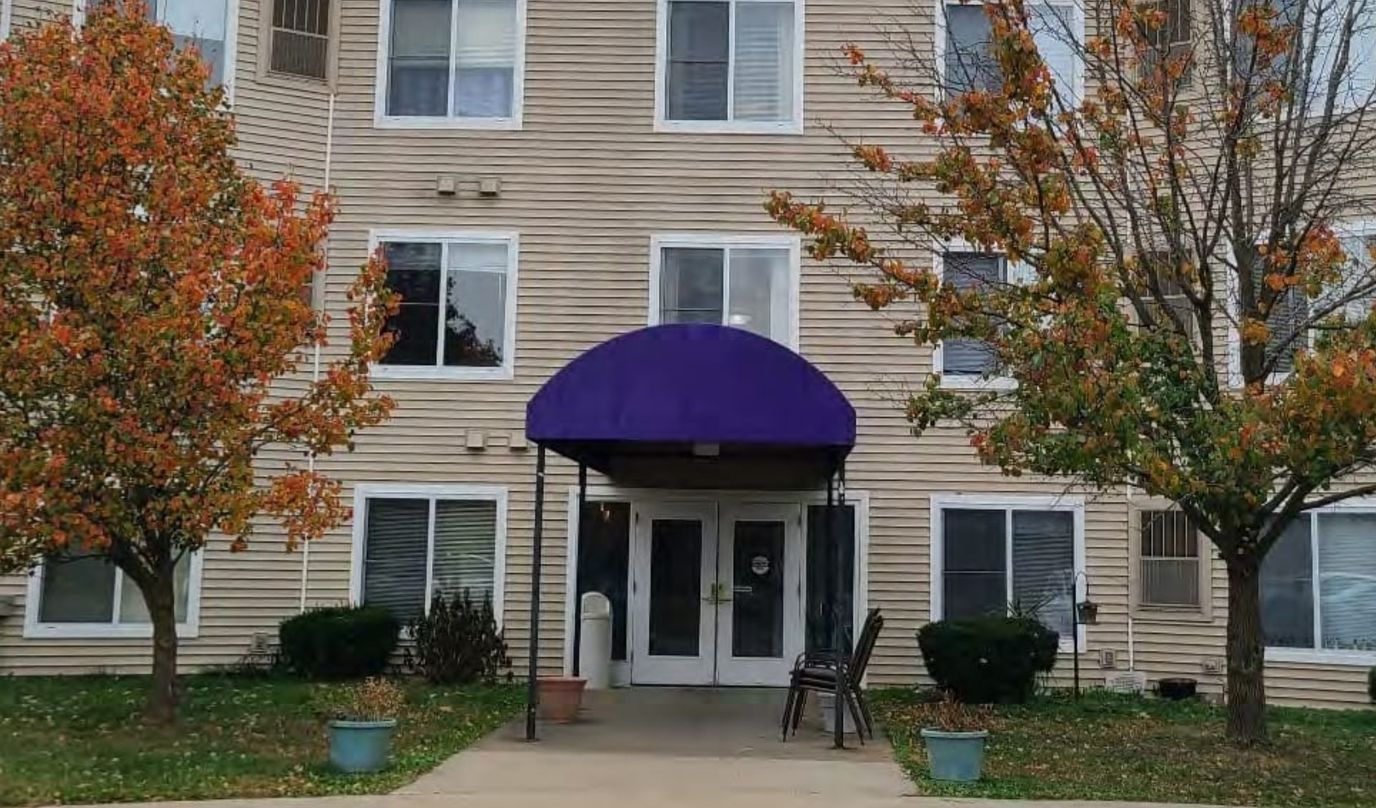 Exterior view of St. Andrew's Apartments with seasonal foliage