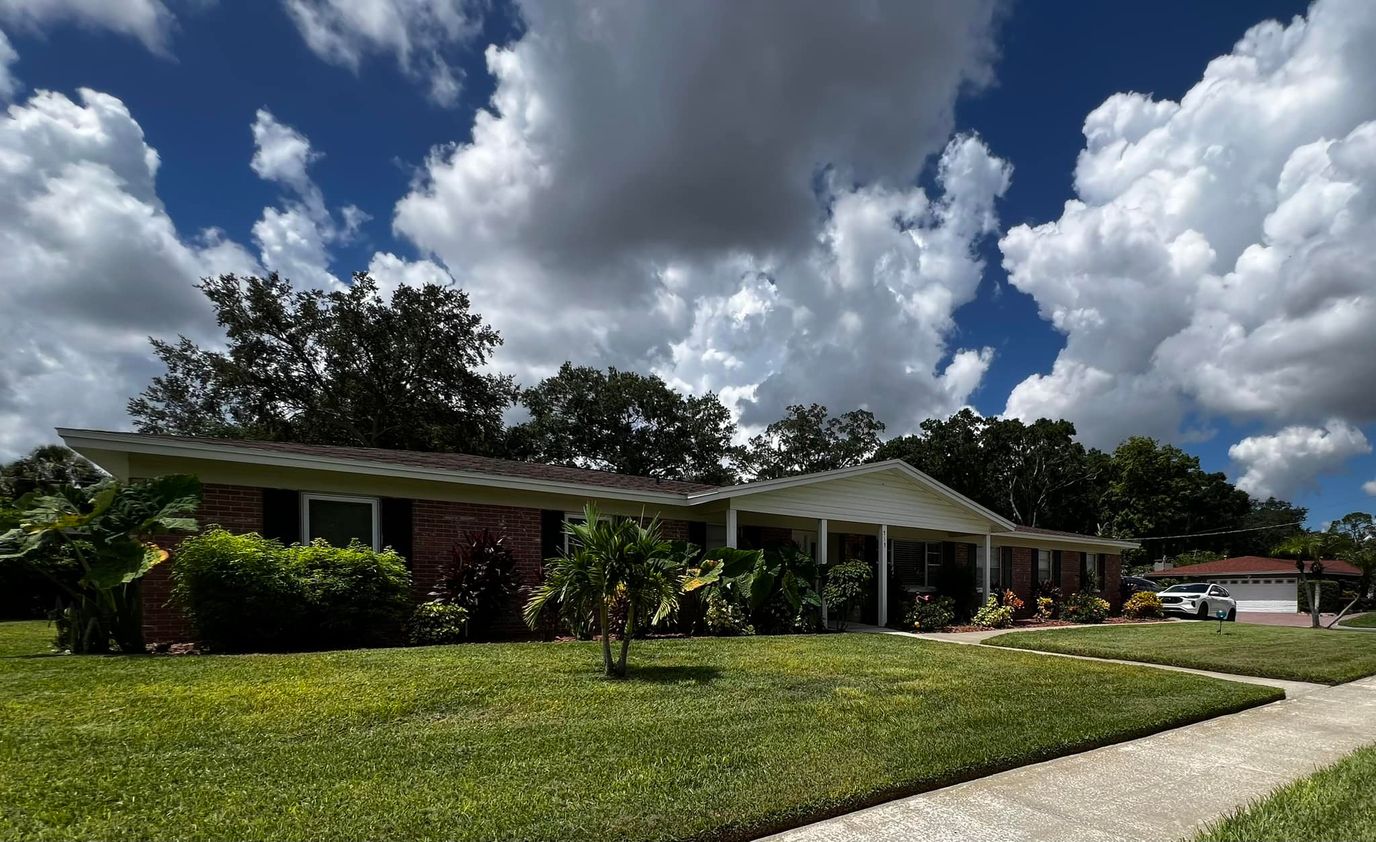 Exterior view of a senior living facility with landscaping