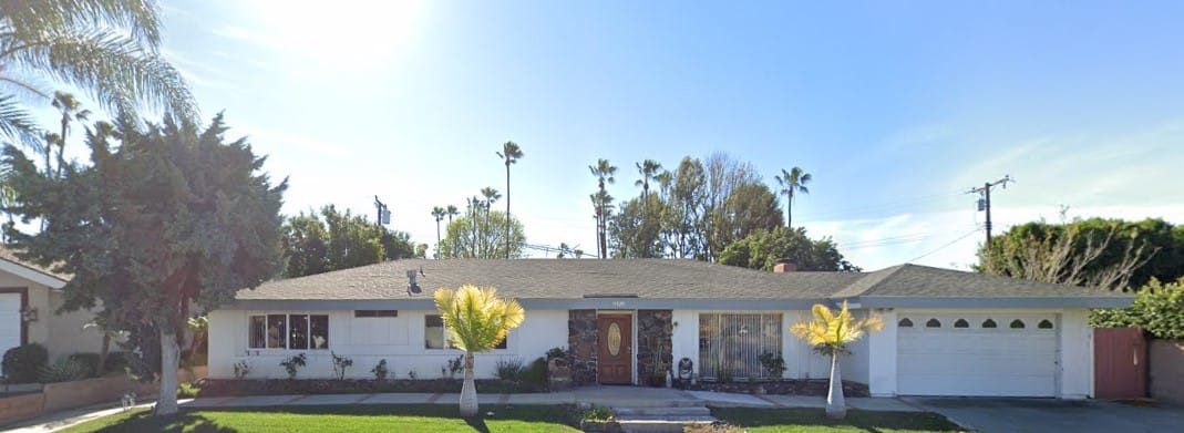 Exterior view of Adelya Senior Homes with palm trees