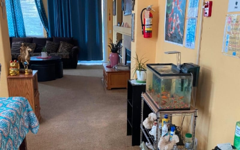 Interior view of a cozy common area with a fish tank