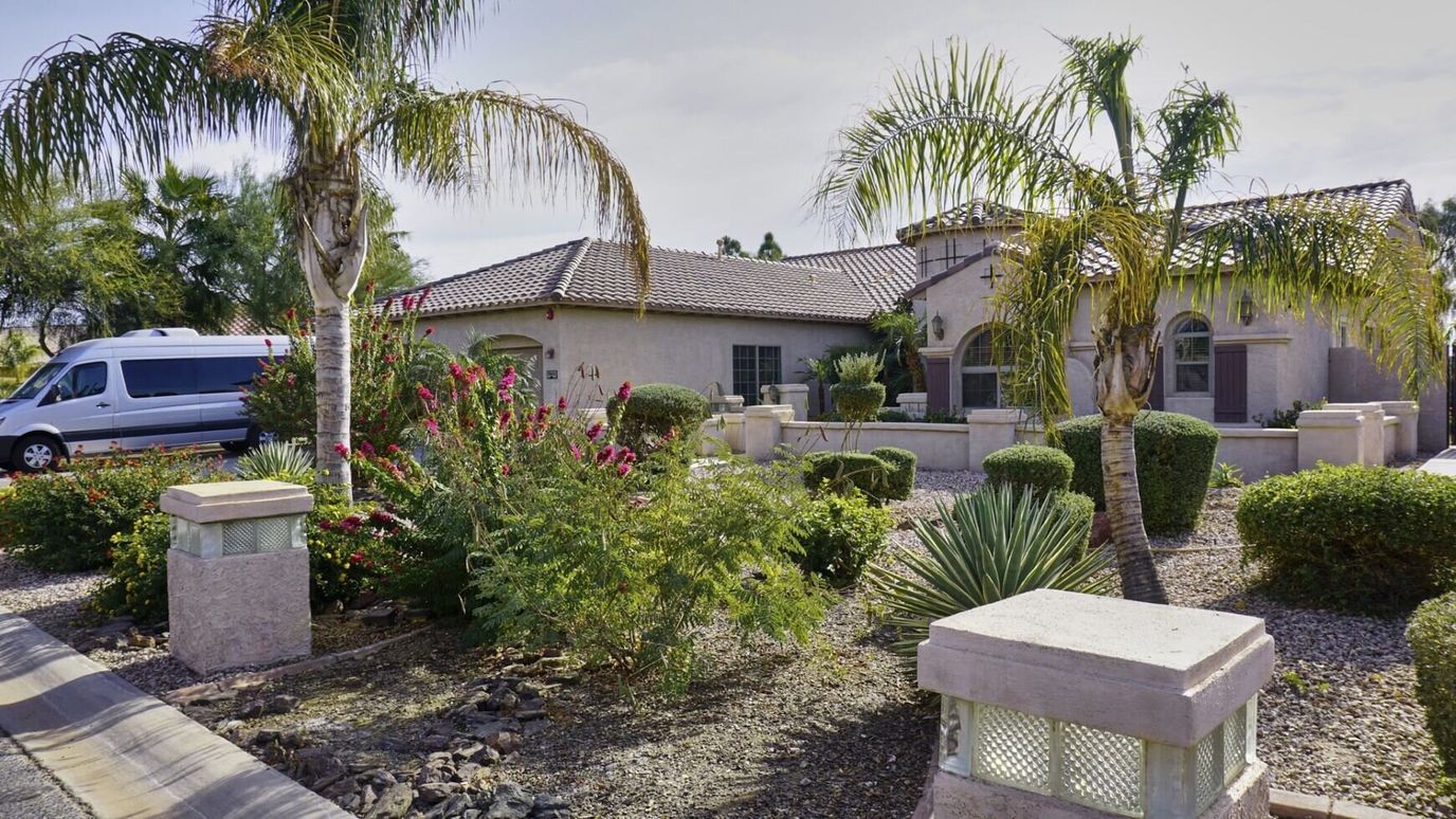 Exterior view of the facility with landscaping and van