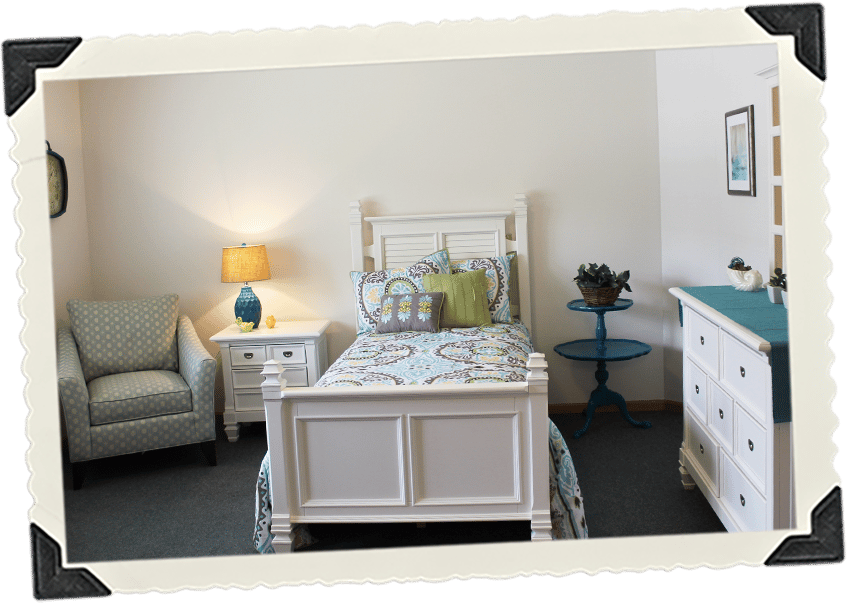 Cozy bedroom setup with a lamp and decorative bedding.