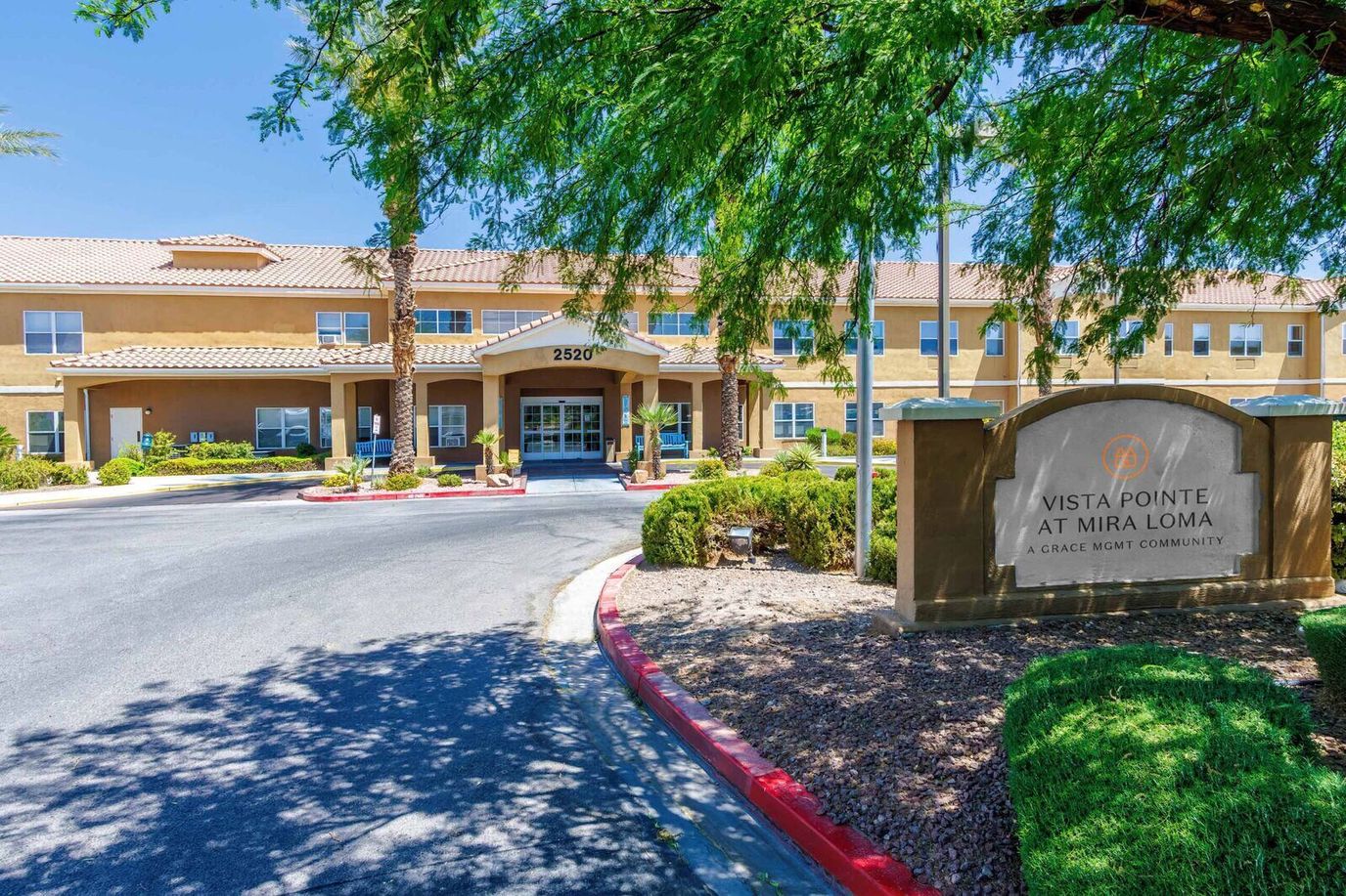 Entrance of Vista Pointe at Mira Loma with landscaping