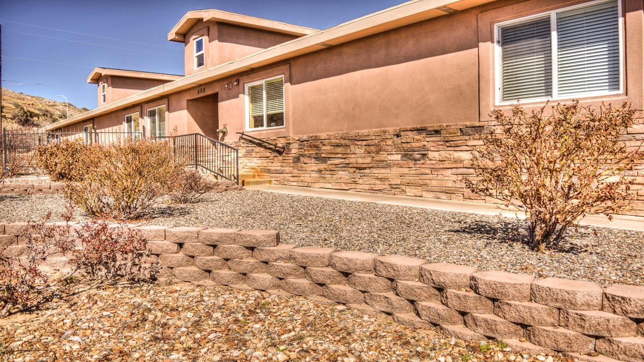 Exterior view of a residential building with landscaping